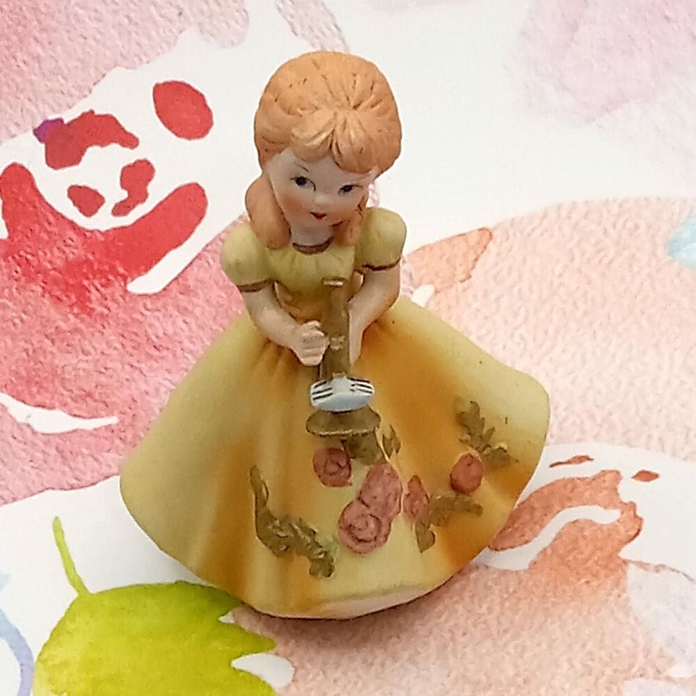 Girl Bisque Figurine Holding Horn Instrument Yellow Dress 4 in Lefton?